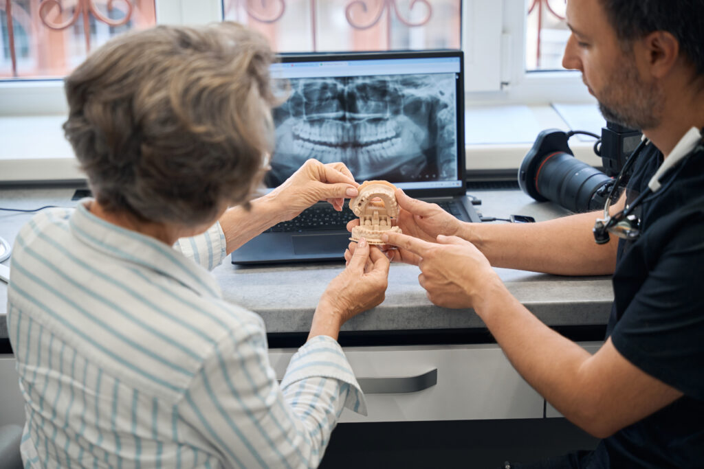 male dental technician is consulting an elderly la 2025 03 08 06 45 11 utc